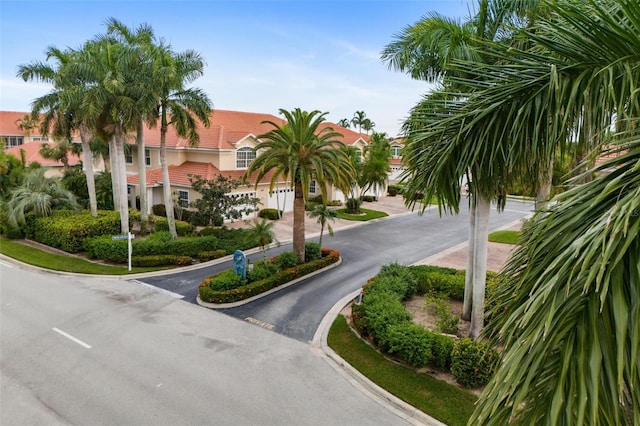 2630 Tarpon Cove Dr Unit 212, Punta Gorda, FL 33950 - view of asphalt road with curbs and a residential view