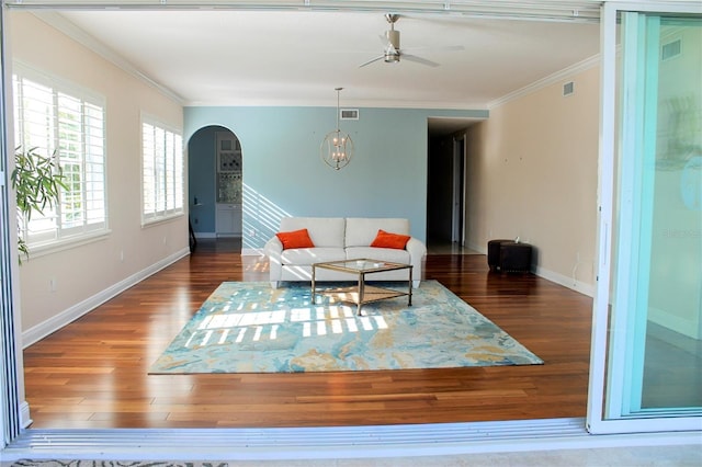 2630 Tarpon Cove Dr Unit 212, Punta Gorda, FL 33950 - living area featuring arched walkways, wood finished floors, a ceiling fan, crown molding, and baseboards