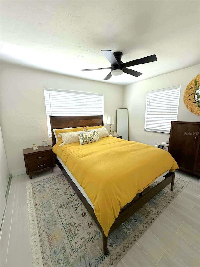 22334 Augusta Ave, Port Charlotte, FL 33952 - bedroom featuring multiple windows and ceiling fan