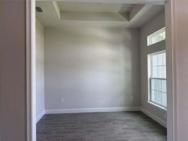 10023 Greetings St, Port Charlotte, FL 33981 - unfurnished room with wood finish floors and a raised ceiling