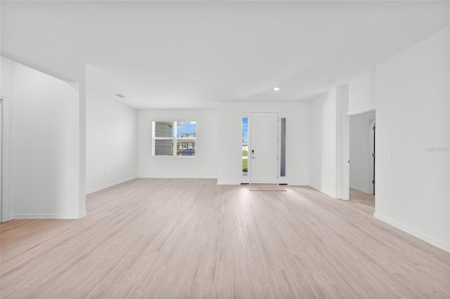 2138 Blaser St, Punta Gorda, FL 33980 - unfurnished living room featuring light wood-style floors and recessed lighting
