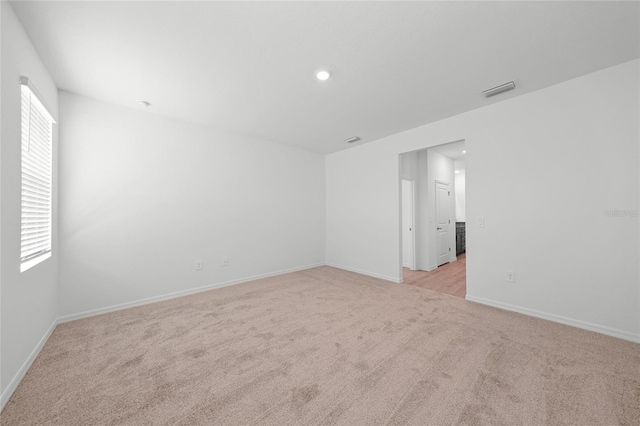 2138 Blaser St, Punta Gorda, FL 33980 - empty room featuring light colored carpet and recessed lighting