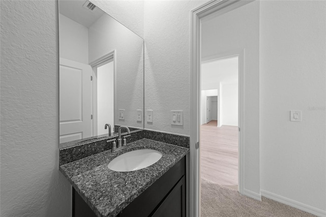 2138 Blaser St, Punta Gorda, FL 33980 - bathroom featuring a textured wall and vanity