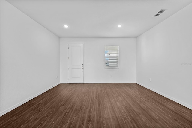 7345 Ellis Ln, Port Charlotte, FL 33981 - spare room with dark wood-type flooring and recessed lighting