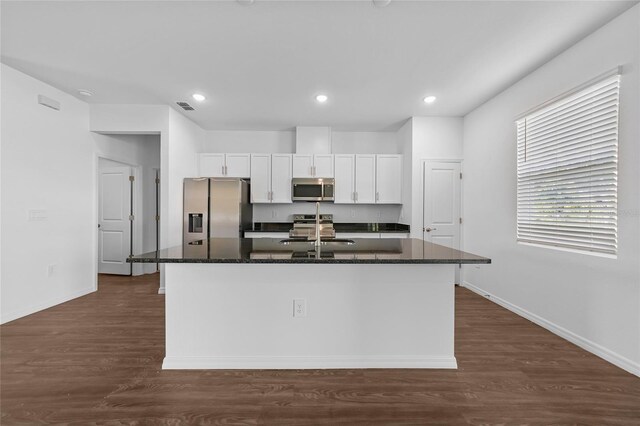 7345 Ellis Ln, Port Charlotte, FL 33981 - kitchen featuring stainless steel appliances, a kitchen island with sink, white cabinets, dark wood finished floors, and recessed lighting