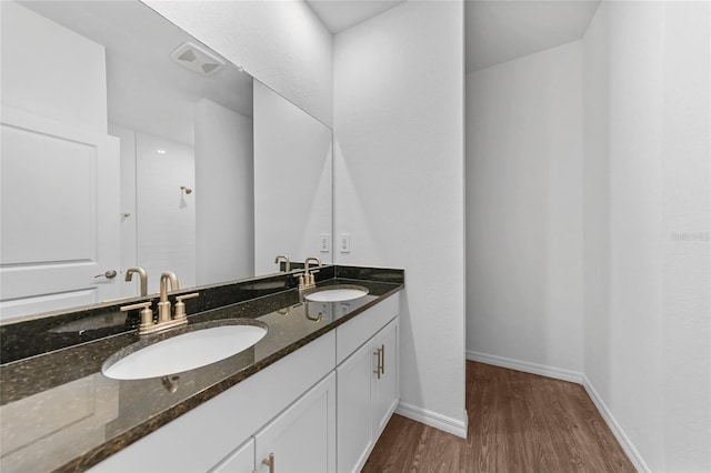 7345 Ellis Ln, Port Charlotte, FL 33981 - full bath with double vanity, wood finished floors, and a shower