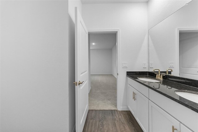 7345 Ellis Ln, Port Charlotte, FL 33981 - bathroom with double vanity and wood finished floors