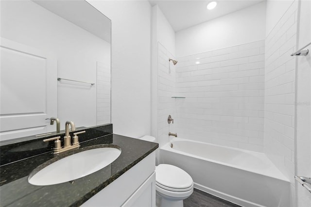 7345 Ellis Ln, Port Charlotte, FL 33981 - full bathroom featuring vanity, washtub / shower combination, and wood finished floors