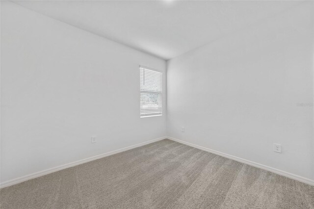 7345 Ellis Ln, Port Charlotte, FL 33981 - carpeted empty room featuring baseboards