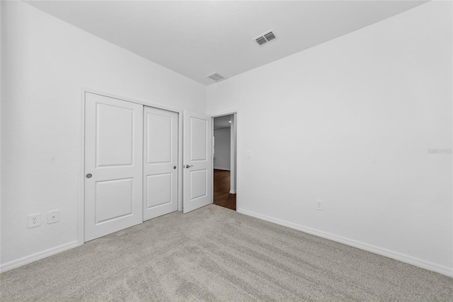 7345 Ellis Ln, Port Charlotte, FL 33981 - unfurnished bedroom featuring carpet floors and a closet