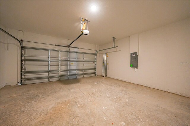 7345 Ellis Ln, Port Charlotte, FL 33981 - garage with electric panel and a garage door opener