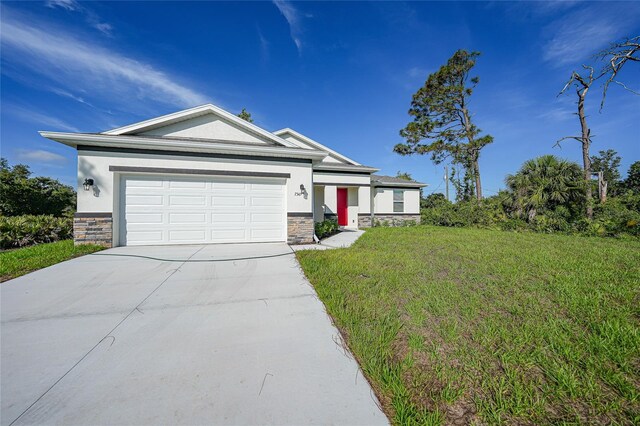 7345 Ellis Ln, Port Charlotte, FL 33981 - view of front of house with stone siding, concrete driveway, a front yard, and a garage