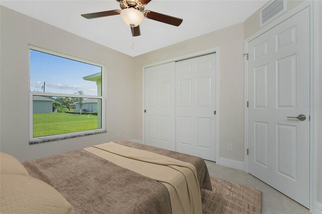 2451 Waller Rd, North Port, FL 34288 - bedroom with a closet, ceiling fan, and light colored carpet