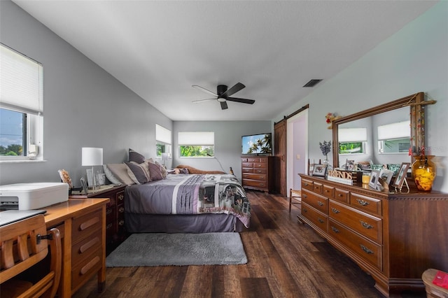 405 Ridgecrest Dr, Punta Gorda, FL 33982 - bedroom featuring dark wood-style flooring, a barn door, and a ceiling fan