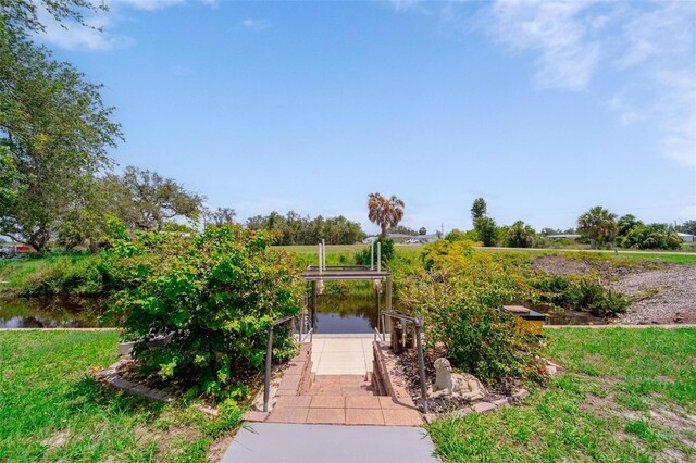 405 Ridgecrest Dr, Punta Gorda, FL 33982 - view of home's community with a boat dock and a garage