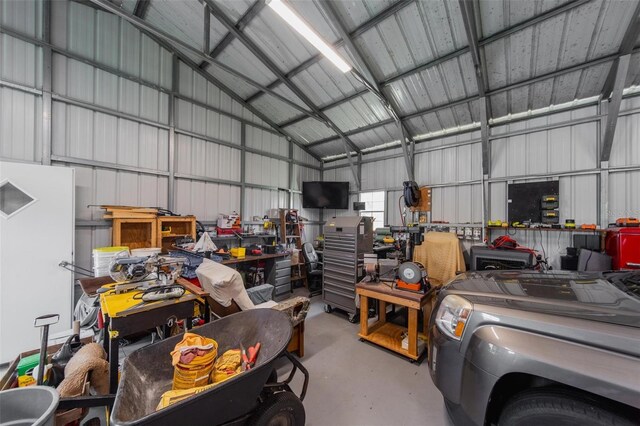 405 Ridgecrest Dr, Punta Gorda, FL 33982 - garage featuring a workshop area and metal wall