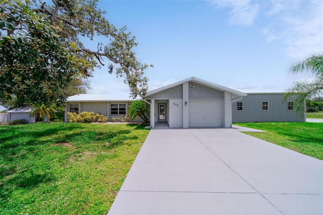 405 Ridgecrest Dr, Punta Gorda, FL 33982 - view of front of home with a front lawn, concrete driveway, and an attached garage