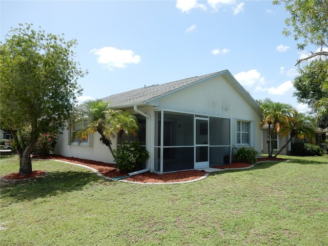 500 Winwood Ct, Port Charlotte, FL 33954 - back of property with a yard and a sunroom