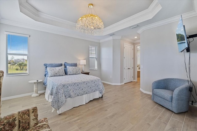 15039 Black Cherry Way, Punta Gorda, FL 33955 - bedroom with a tray ceiling, crown molding, a chandelier, light wood finished floors, and recessed lighting