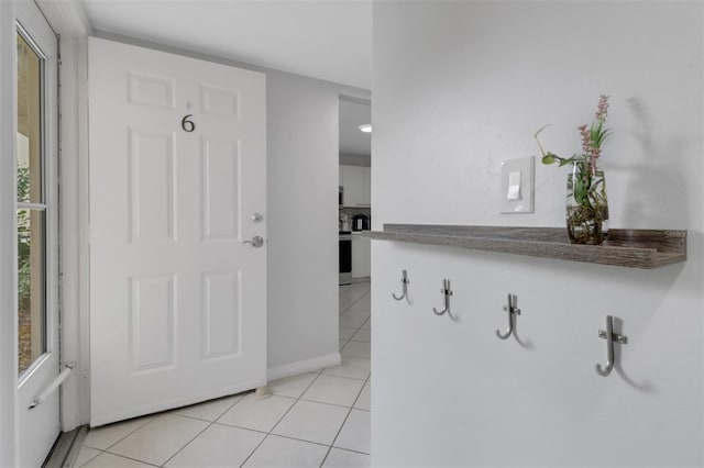 196 Furse Lakes Cir Unit A6, Naples, FL 34104 - entrance foyer featuring light tile patterned flooring and baseboards