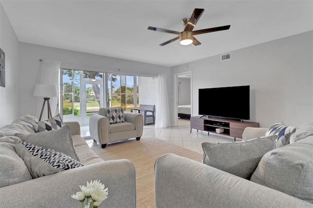 196 Furse Lakes Cir Unit A6, Naples, FL 34104 - living room with a ceiling fan and light tile patterned flooring