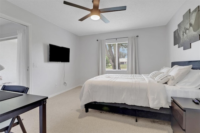 196 Furse Lakes Cir Unit A6, Naples, FL 34104 - carpeted bedroom with ceiling fan, a textured ceiling, an office area, and baseboards