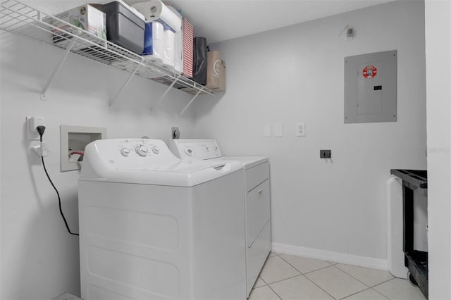 196 Furse Lakes Cir Unit A6, Naples, FL 34104 - laundry area with electric panel, independent washer and dryer, light tile patterned flooring, and baseboards
