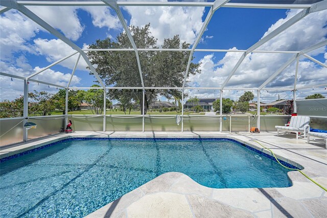 37 Pepe Ct, Punta Gorda, FL 33983 - outdoor pool featuring a patio and glass enclosure
