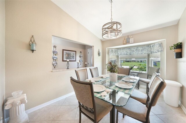 37 Pepe Ct, Punta Gorda, FL 33983 - dining space featuring vaulted ceiling, a chandelier, and light tile patterned flooring