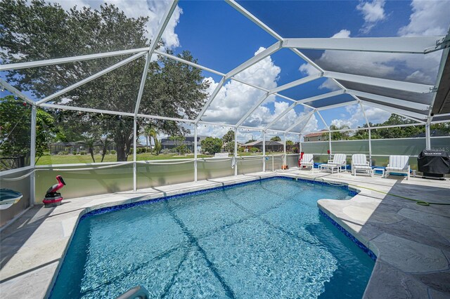 37 Pepe Ct, Punta Gorda, FL 33983 - swimming pool with a patio area, a grill, and a lanai