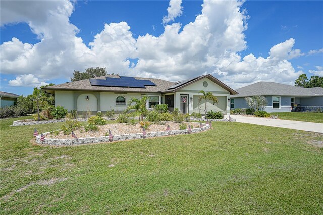 37 Pepe Ct, Punta Gorda, FL 33983 - ranch-style house with stucco siding, driveway, solar panels, and a front yard