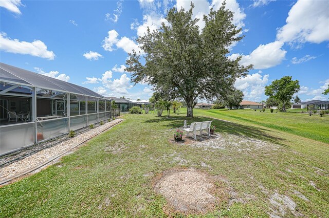 37 Pepe Ct, Punta Gorda, FL 33983 - view of green lawn with glass enclosure