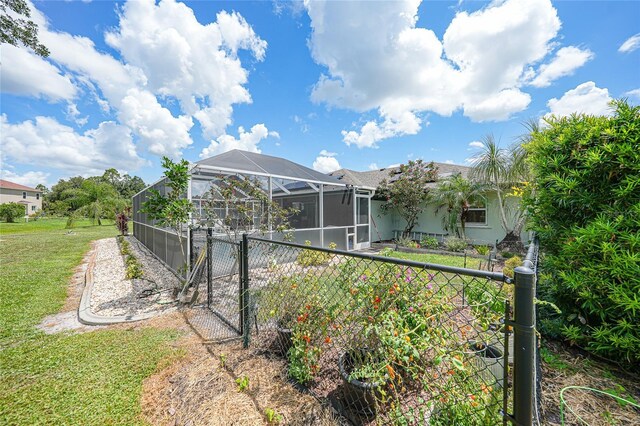 37 Pepe Ct, Punta Gorda, FL 33983 - rear view of property with stucco siding, glass enclosure, and a gate