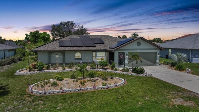 37 Pepe Ct, Punta Gorda, FL 33983 - ranch-style house with stucco siding, a front lawn, concrete driveway, and an attached garage