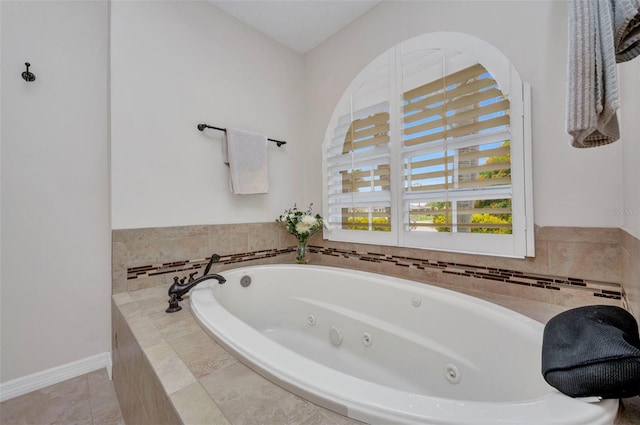 250 Freeport Ct, Punta Gorda, FL 33950 - bathroom featuring a tub with jets and tile patterned floors