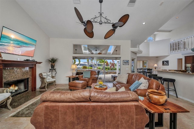 250 Freeport Ct, Punta Gorda, FL 33950 - living area with a high end fireplace, a chandelier, and a towering ceiling