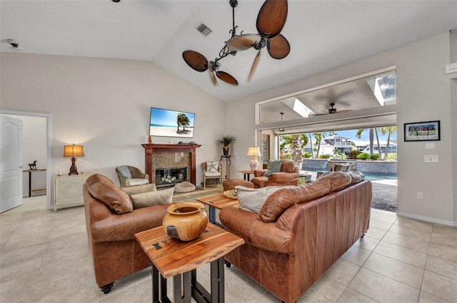 250 Freeport Ct, Punta Gorda, FL 33950 - living room with a ceiling fan, a fireplace, lofted ceiling, a skylight, and light tile patterned floors
