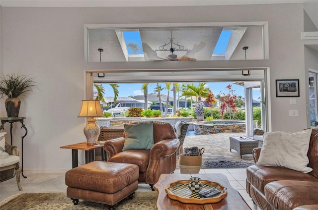 250 Freeport Ct, Punta Gorda, FL 33950 - tiled living area featuring plenty of natural light and a skylight