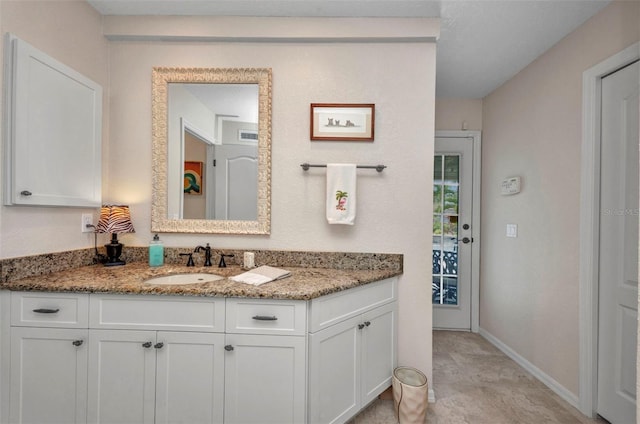 250 Freeport Ct, Punta Gorda, FL 33950 - bathroom featuring vanity and baseboards
