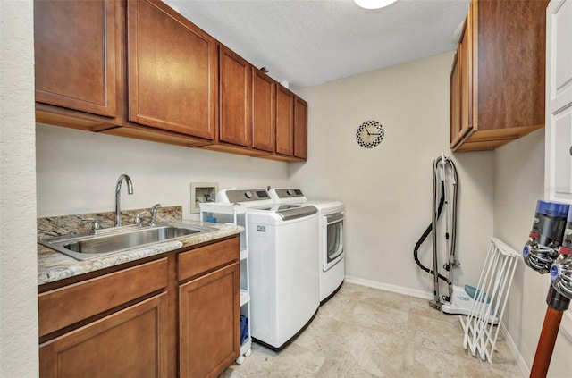 250 Freeport Ct, Punta Gorda, FL 33950 - laundry area with separate washer and dryer, cabinet space, and a textured ceiling