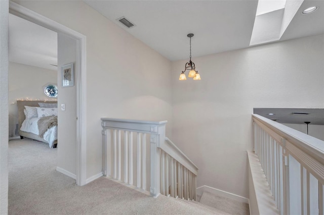 250 Freeport Ct, Punta Gorda, FL 33950 - staircase with carpet floors and a chandelier