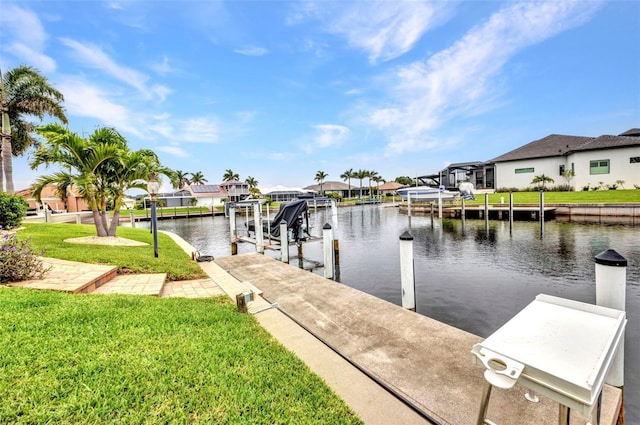 250 Freeport Ct, Punta Gorda, FL 33950 - dock with boat lift, a water view, a residential view, and a yard