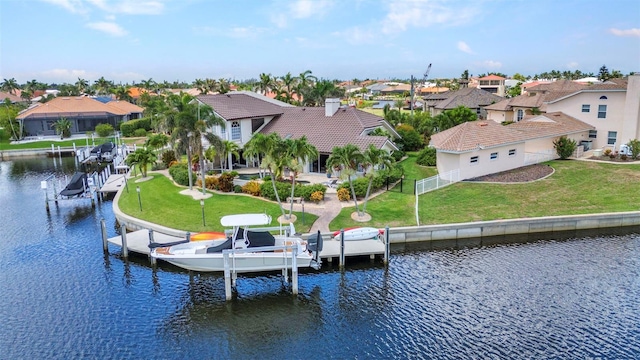 250 Freeport Ct, Punta Gorda, FL 33950 - dock area with boat lift, a residential view, a water view, a fenced backyard, and a patio area