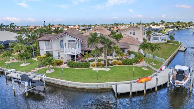 250 Freeport Ct, Punta Gorda, FL 33950 - rear view of property with boat lift, a balcony, a water view, and a residential view