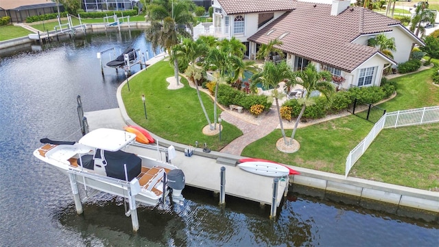 250 Freeport Ct, Punta Gorda, FL 33950 - dock area with boat lift, a water view, and a fenced backyard