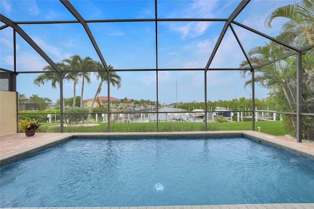 1527 Aqui Esta Dr Unit 3, Punta Gorda, FL 33950 - swimming pool with a lanai, a water view, a lawn, and a patio