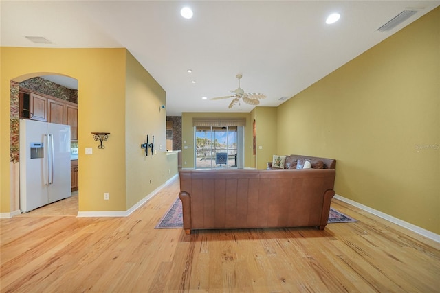 1527 Aqui Esta Dr Unit 3, Punta Gorda, FL 33950 - living room featuring light wood-style flooring, ceiling fan, arched walkways, and recessed lighting