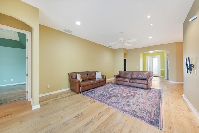 1527 Aqui Esta Dr Unit 3, Punta Gorda, FL 33950 - living room with arched walkways, wood finished floors, ceiling fan, and recessed lighting