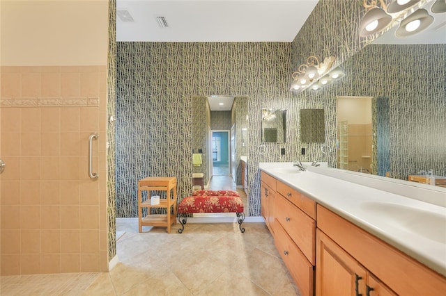 1527 Aqui Esta Dr Unit 3, Punta Gorda, FL 33950 - bathroom featuring tile patterned floors, double vanity, a shower stall, and a chandelier