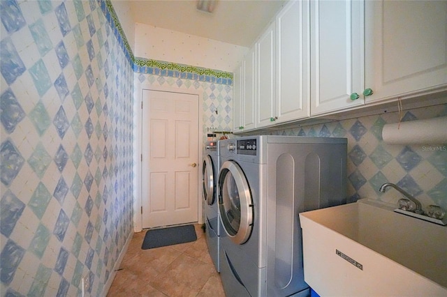 1527 Aqui Esta Dr Unit 3, Punta Gorda, FL 33950 - washroom with cabinet space, washing machine and clothes dryer, light tile patterned flooring, and wallpapered walls